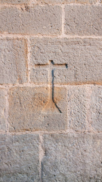 istock Carved cross in stone monumental wall 1420104836