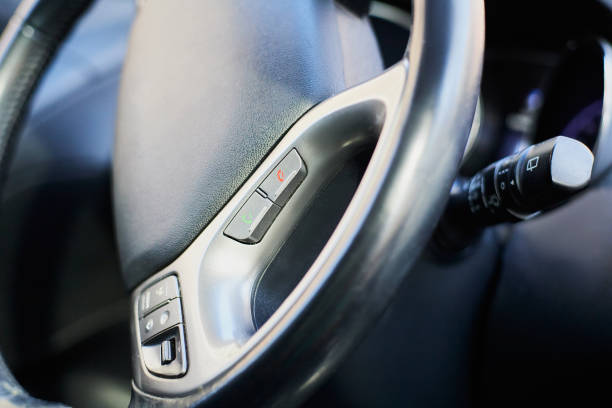 istock Macro close-up of bluetooth phone pick up button on wheel. 1420106086