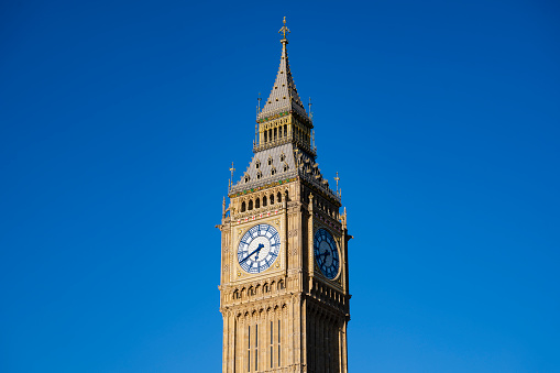 Upper section of 19th-century Gothic Revival style Clock Tower, renamed Elizabeth Tower in 2012, located at north end of Palace of Westminster.