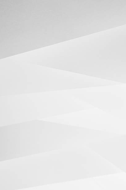 White abstract geometric background with soft light paper inclined vertical lines or surfaces with gradient as pattern, vertical. Simple elegant modern backdrop in minimal style.
