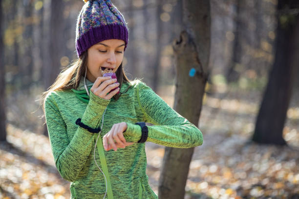 istock Young girl eating power bar 1420110508