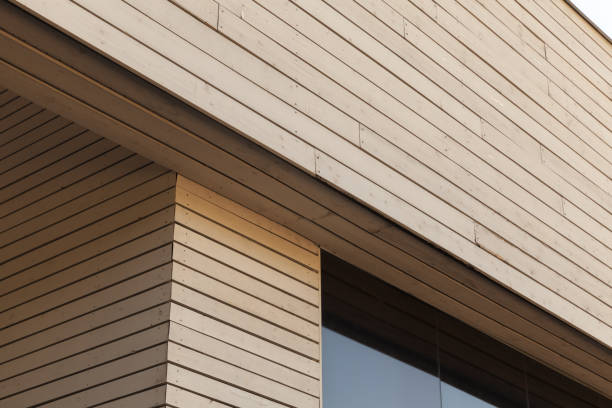Abstract architectural background, wooden facade fragment with black window corner