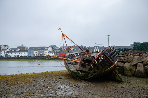Old abandoned ship stranded in a harbor in Galway