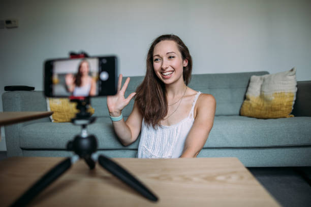istock Beautiful woman vlogging at home 1420115414