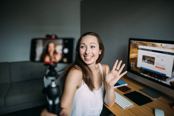 istock Beautiful woman vlogging at home 1420115457