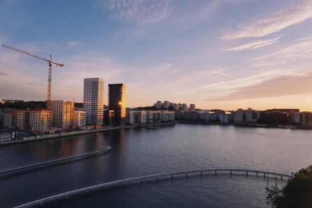 istock scenic view of river by buildings against sky during sunset 1420116272