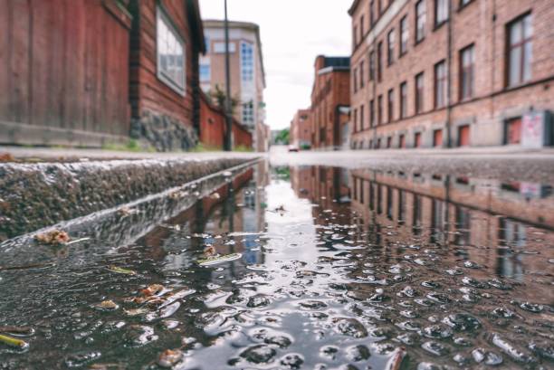 istock Wet empty road in city 1420116430