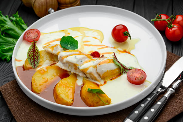 istock Chicken fillet in a creamy sauce with caramelized pear 1420116661
