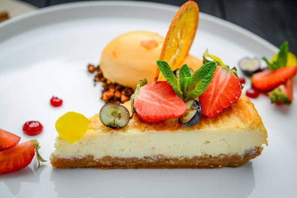 istock cheesecake with berries and sorbet on plates 1420116666