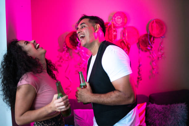 istock Couple talking and having fun at a party 1420118759