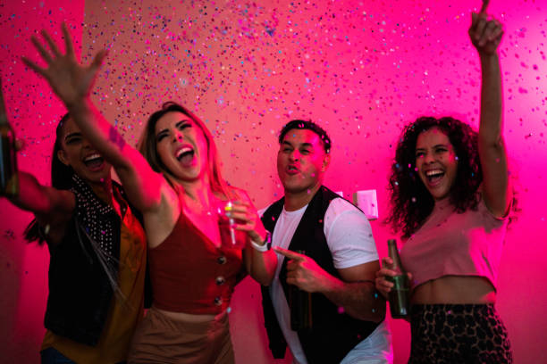 istock Friends celebrating while drinking beer at a party 1420118862