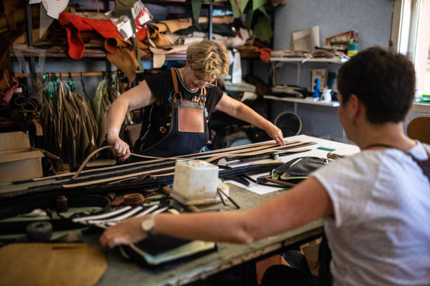 istock Two women working in a leather factory 1420120345