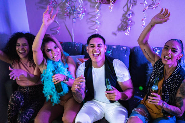 istock Friends celebrating and drinking beer at a party 1420123257