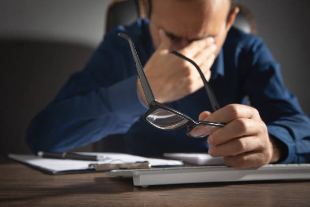 istock Caucasian man with eye fatigue. Stress. Eyesight problem 1420123336