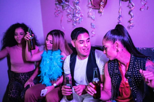 istock Drunk friends having fun while drinking beer at a party 1420123440