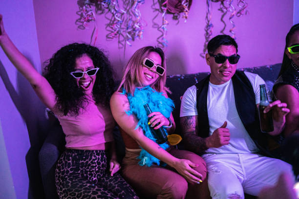 istock Drunk friends having fun at a party 1420123905