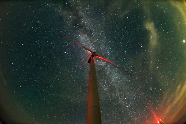 istock Wind power plant under the stars 1420126598