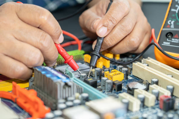 istock Technician repairing inside of mobile phone by soldering iron. 1420134026