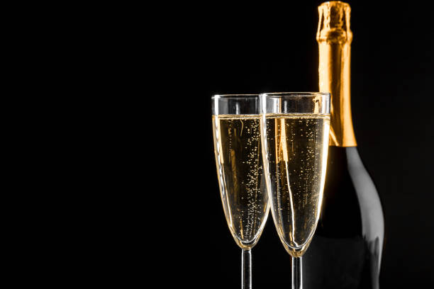 istock glasses of champagne with the bottle 1420134323