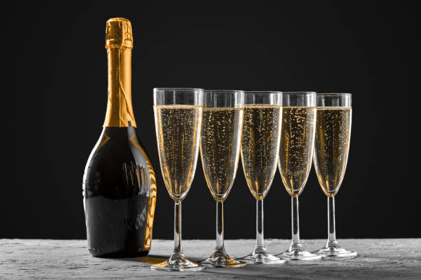 glasses of champagne with the bottle stock photo