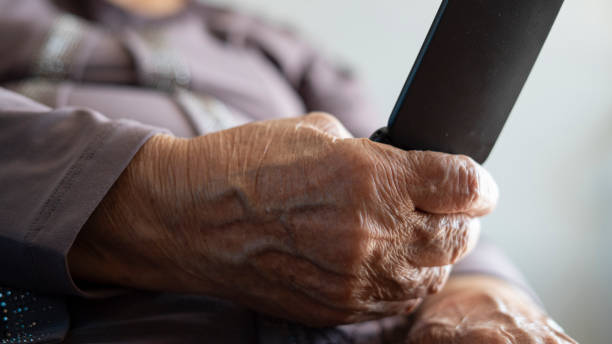 istock Old woman using retro phone 1420137990