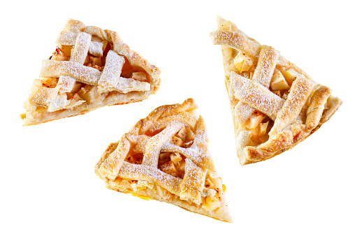 Collection of triangular pieces of apple pie with lattice isolated on white background