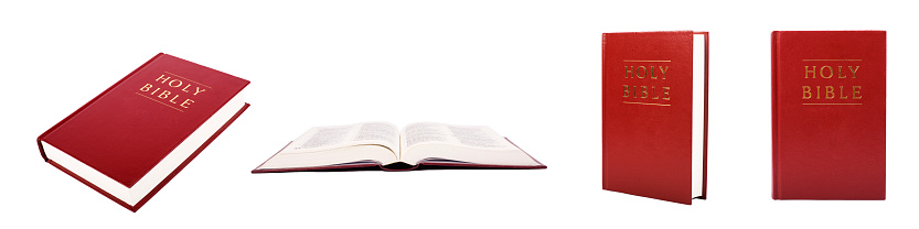 Bible with red cover color isolated on white background