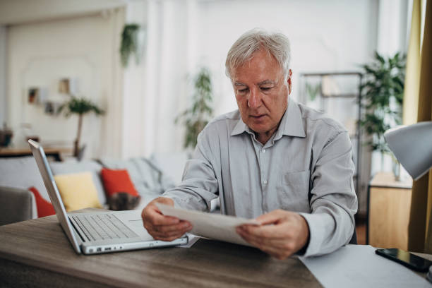 istock Senior man in home office 1420143305