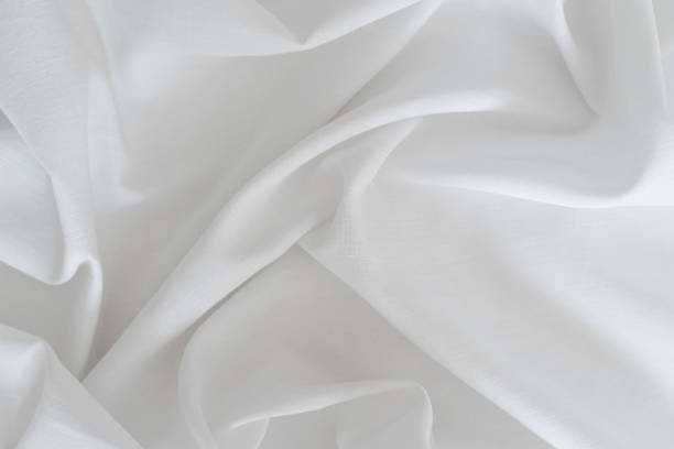 sfondo in tessuto di lino drappeggio bianco. texture della superficie leggera del tessuto. - lenzuolo foto e immagini stock