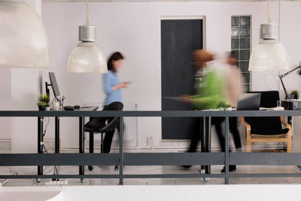 istock Diverse employees silhouettes walking in business coworking space 1420144761