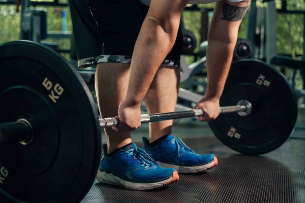 istock Deadlift weight training, Man plus size workout with barbell weight lifting training in loss weight course at gym. 1420146892