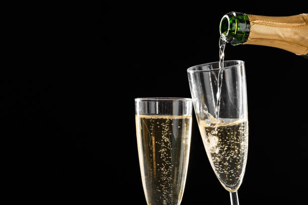 istock glasses of champagne with the bottle 1420147512