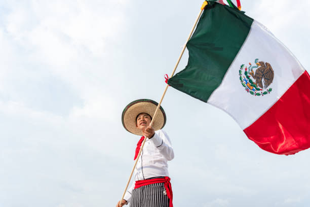 istock Young boy holding flag of Mexico 1420151314