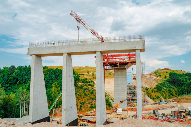 istock Constructing concrete pillars of the bridge. Construction of the new M12 highway 1420152755