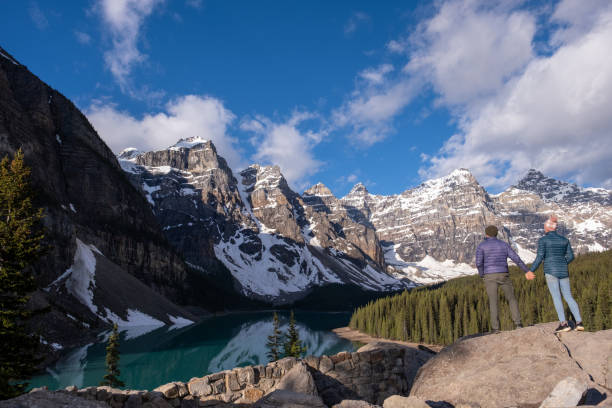 istock Couple  admires the view over the pristine lake 1420155925
