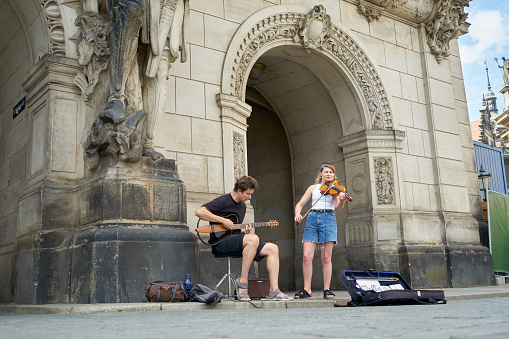 Street musicians play classical music in the historic center of Dresden, Germany, near the Cathedral of the Holy Trinity, August 9, 2022\n\nDresden Cathedral, or the Cathedral of the Holy Trinity, previously the Catholic Church of the Royal Court of Saxony, (in German Katholische Hofkirche) and since 1980 also known as Kathedrale Sanctissimae Trinitatis, is the Catholic Cathedral of Dresden.\n\nAlways the most important Catholic church of the city, it was elevated to the status of the cathedral of the Diocese of Dresden–Meissen in 1964. It is located near the Elbe river in the historic center of Dresden, Germany.