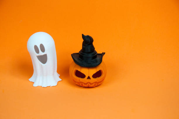 istock Halloween background  with pumpkin with hat  and a ghost 1420157732
