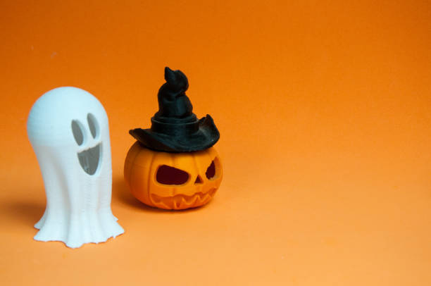 istock halloween background  with pumpkin with hat  and a ghost 1420157753