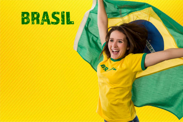 istock Female brazilian fan celebrating 1420159667