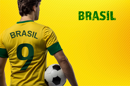brazilian player, man celebrating on a yellow background.