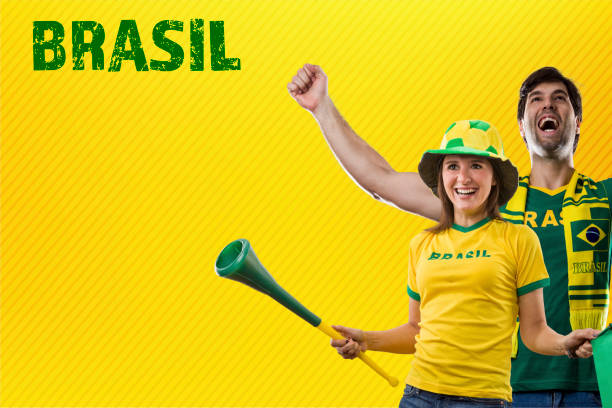 Brazilian Fans, couple Celebrating on a yellow background.