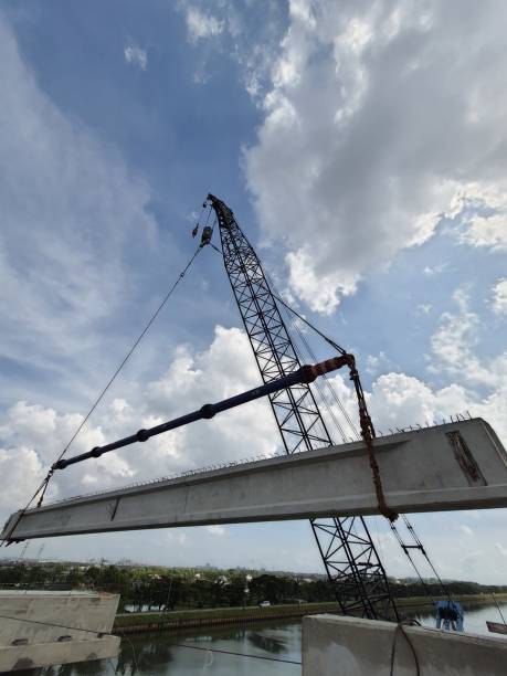 A construction method of lifting precast girder using a single crane stock photo