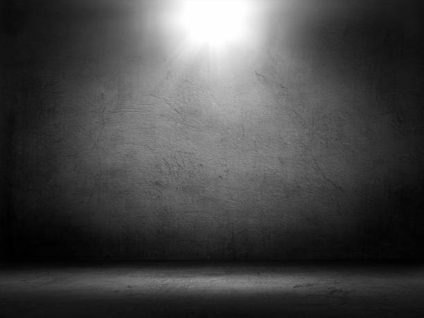 istock 3D dark grunge display background with spotlight shining in interior 1420165368