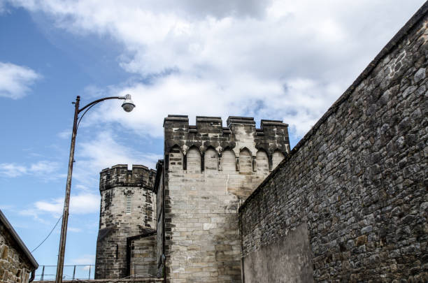 External walls and tower of Eastern State Penitentiary during summer day