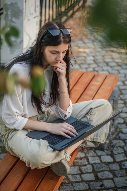 istock Freelancer working on a laptop outdoor 1420174103