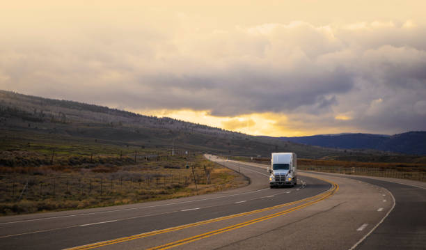 istock Semi-truck driving on empty single line road in Utah 1420177776