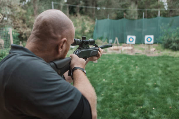 istock A redhead middle aged man trying rifle shooting 1420179377
