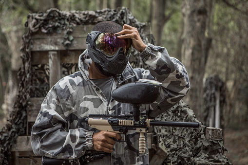 Portrait of a young black paintball team player