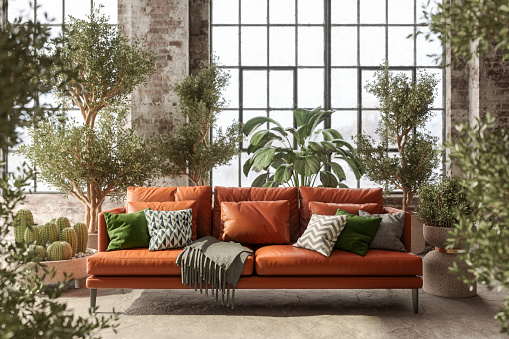 Environmentally Friendly  Living Room With Leather Sofa, Green Plants And Brick Wall