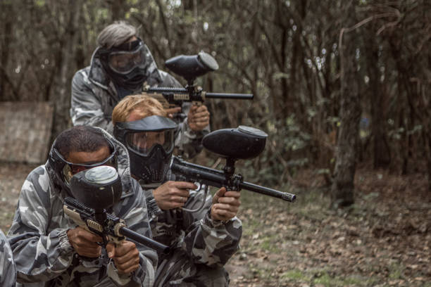 istock A paintball team during a game in a forest 1420181937